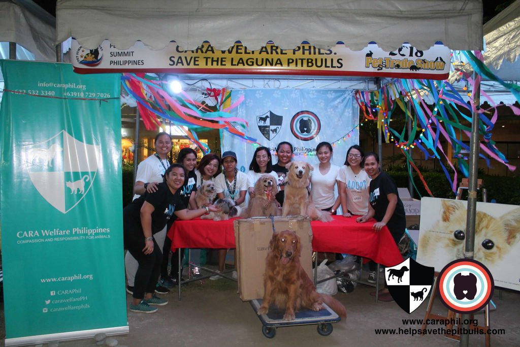 Volunteers and their furry assistants at the CARA Welfare Philippines booth at Pet Summit 2018