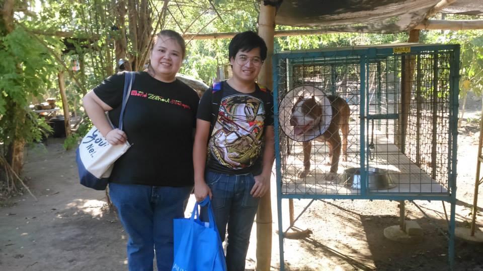 Jennifer Tiu and her brother Jared are greeted by Bailey at the LPB Center. (Photo by Melody de Jesus)